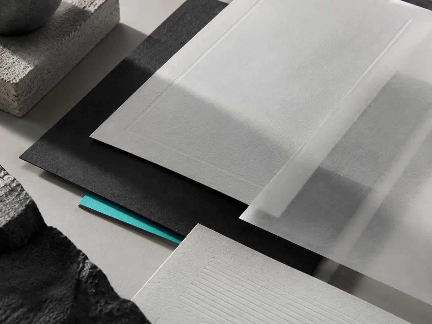 Illustrative arrangement of paper, vellum and blank stationery
